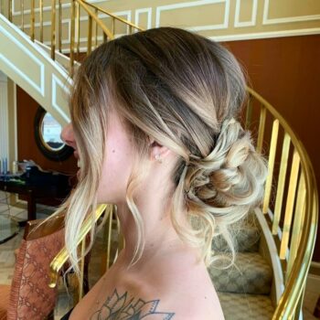 Side view of Bride with braided hair by Summerlin Hair Stylists at The Salon at Lakeside